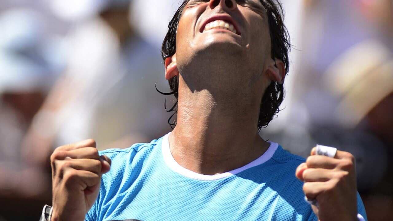 Rafael Nadal from Spain celebrates after defeating Kei Nishhikori
