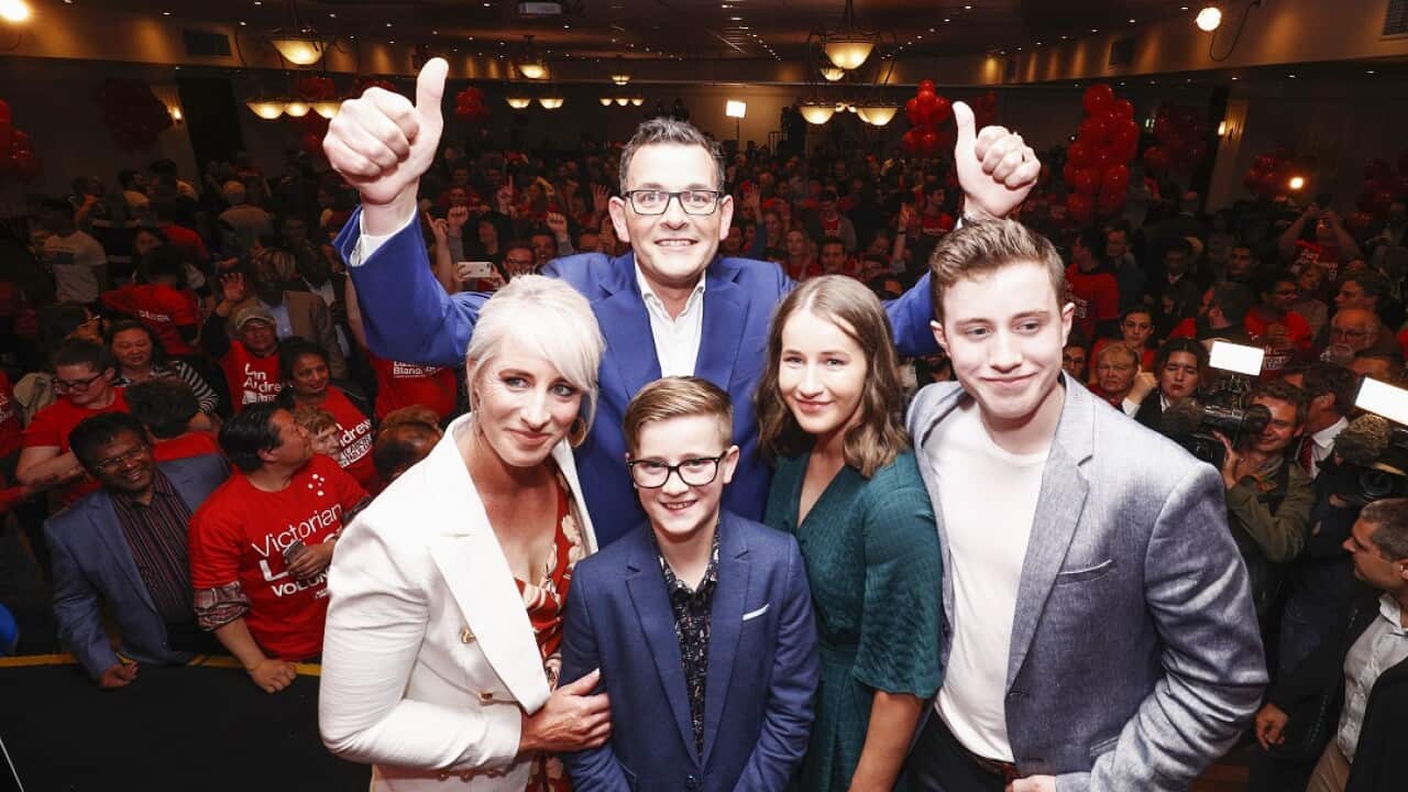Premier Daniel Andrews (top) poses for a photo with his family during the Labor Party reception on Victorian State election night in Melbourne, Saturday, November 24, 2018. (AAP Image/Daniel Pockett) NO ARCHIVING