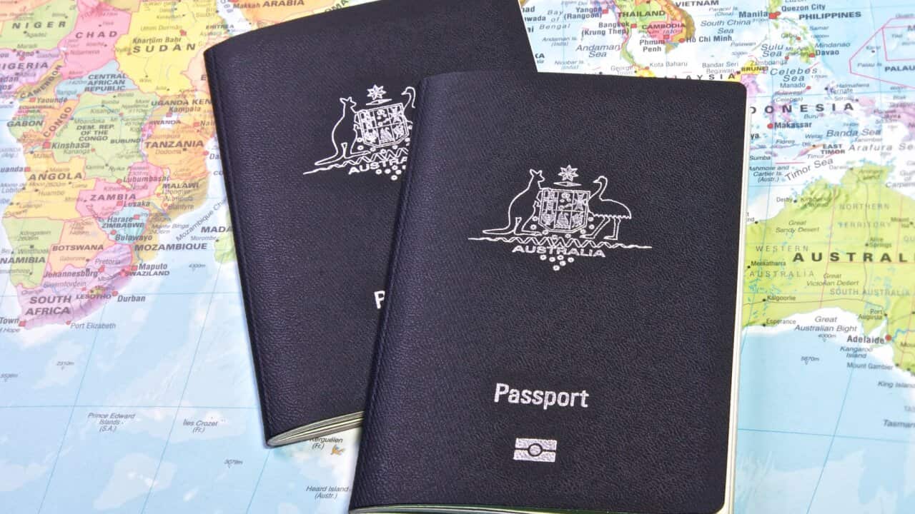 Two passport on a map of the world