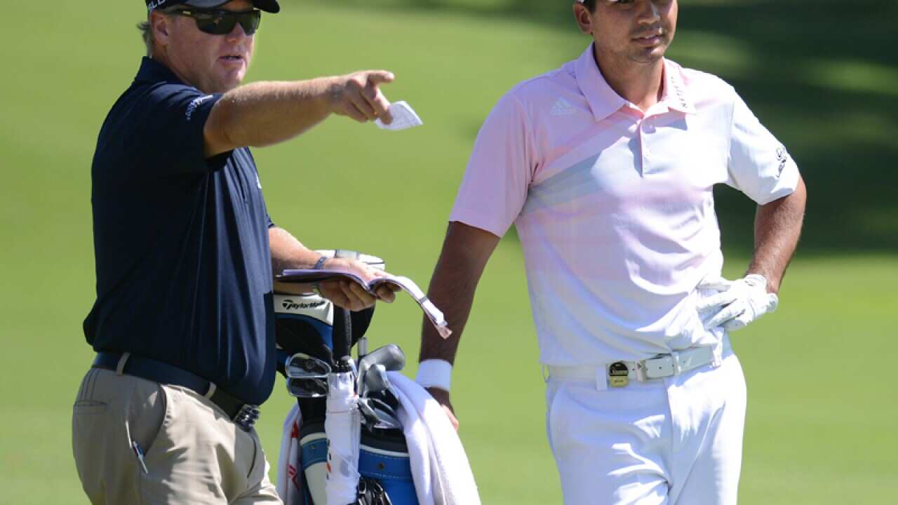 Australian golfer Jason Day (right) with his caddy Col Swatton