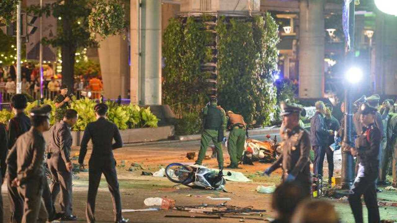 Investigators examine the site of an explosion in central Bangkok on Aug. 17, 2015. The blast near Bangkok's famous Erawan Shrine killed at least 15 people and injured more than 20 others. (AAP)