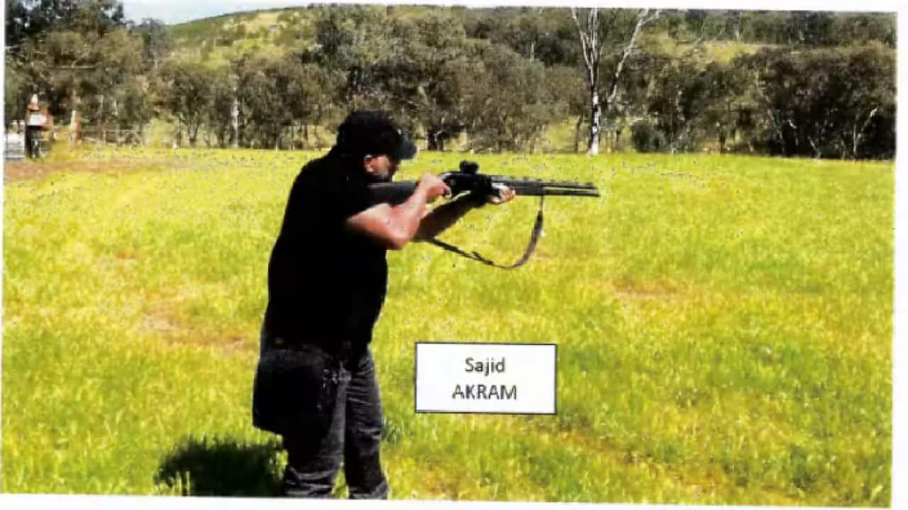 Sajid allegedly pictured with a shotgun in the countryside..png