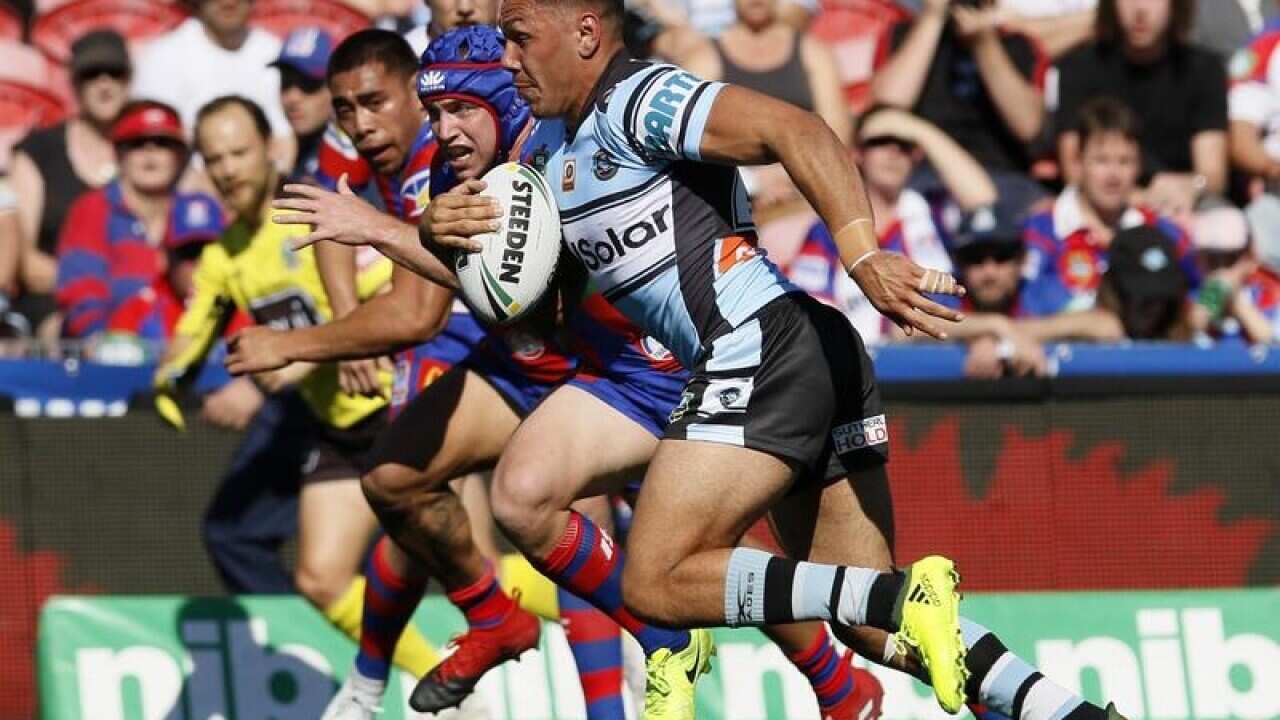 Jesse Ramien of the Sharks runs with the ball.