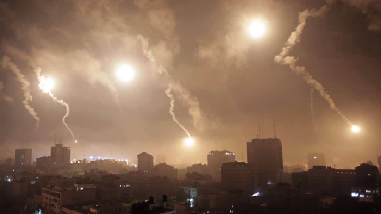 Flares light up the sky over Gaza.