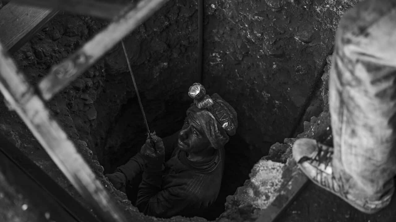 Miner starts the descent in one of the tunnels with little to no safety equioment, most don’t even use a harness (Supplied, David Tiago Barbosa).jpg