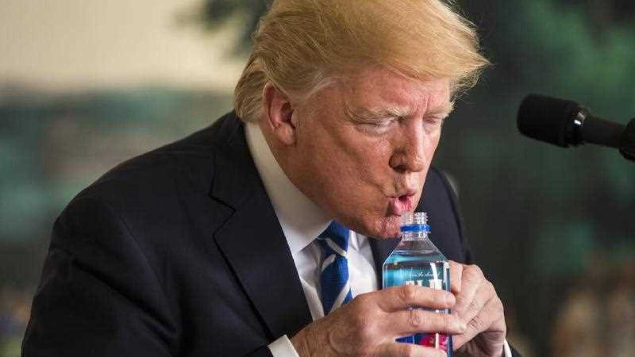 US President Donald J. Trump pauses to drink water while touting his foreign policy accomplishments during his trip to Asia in a speech in the Diplomatic Room at the White House in Washington, DC, USA, 15 November 2017.