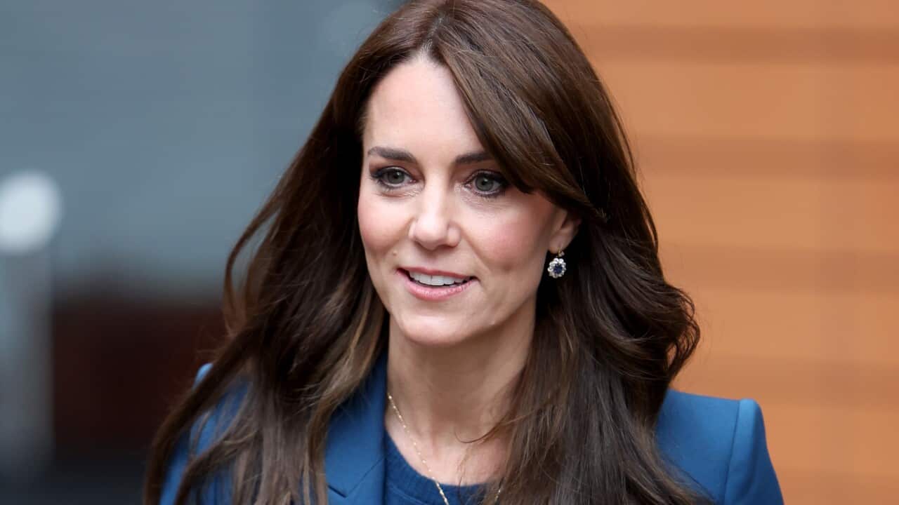 A woman wearing a blue blazer