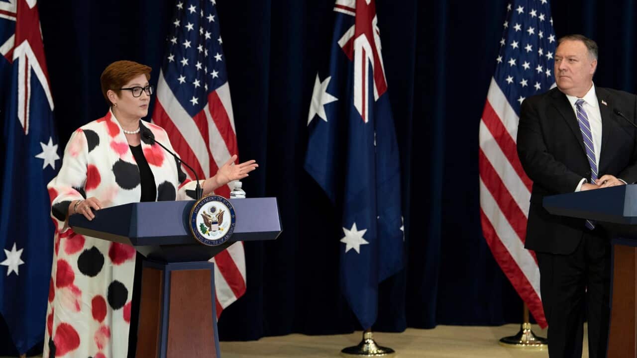 Secretary of State Mike Pompeo listens while Australia's Foreign Minister Marise Payne speaks during a news conference at the State Department Tuesday, July 28, 2020, in Washington.