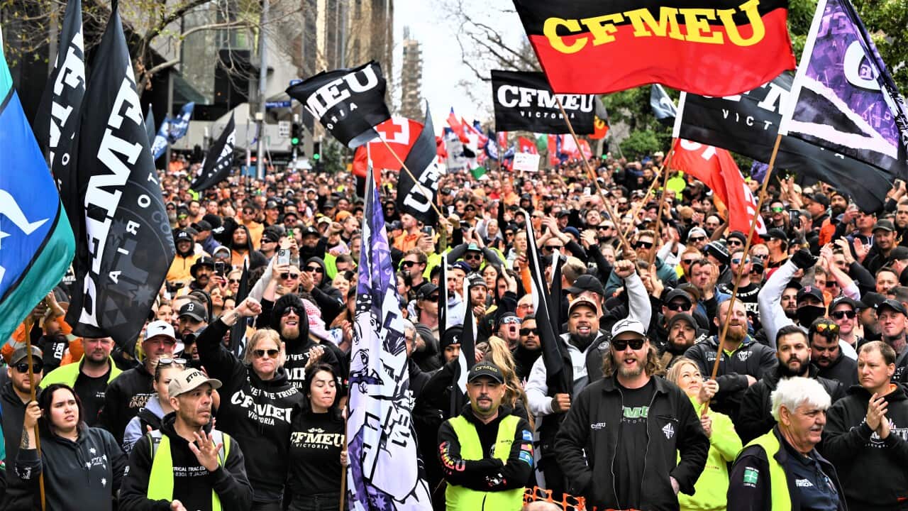 Workers, including members of the Construction, Forestry and Maritime Employees Union (CFMEU), gather out side the Fair Work Commission as they participate in a rally in Melbourne, Tuesday, August 27, 2024. Construction workers will walk off the job in support of deposed CFMEU leaders after the union was forced into administration.
