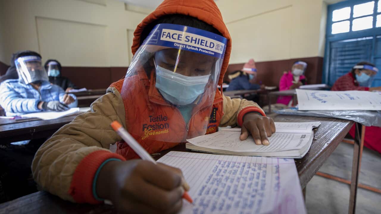 Students of Yuba Pratibha School in Nepal, wearing a face shield and masks at school during a coronavirus pandemic in Kathmandu, Nepal, 26 November 2020. The head Teacher of Yuba Pratibha School, Yanga Raj Dahal, started to conduct classes for student