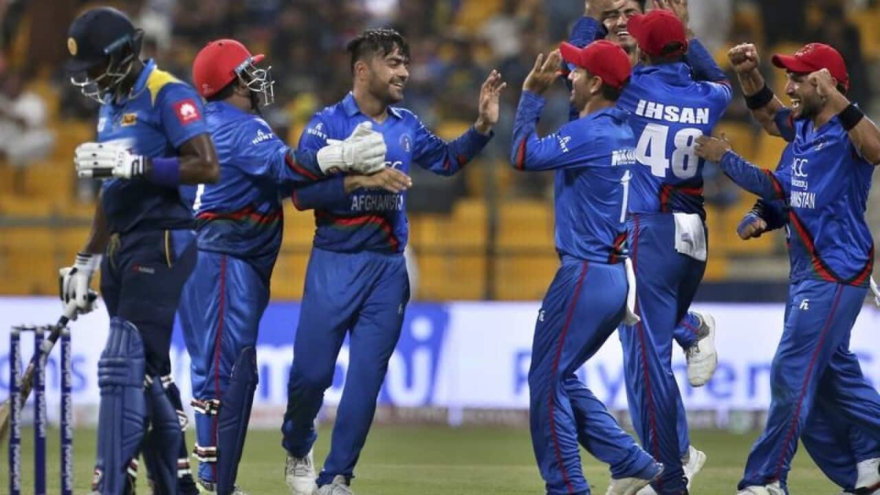 Afghanistan's Rashid Khan, third left.