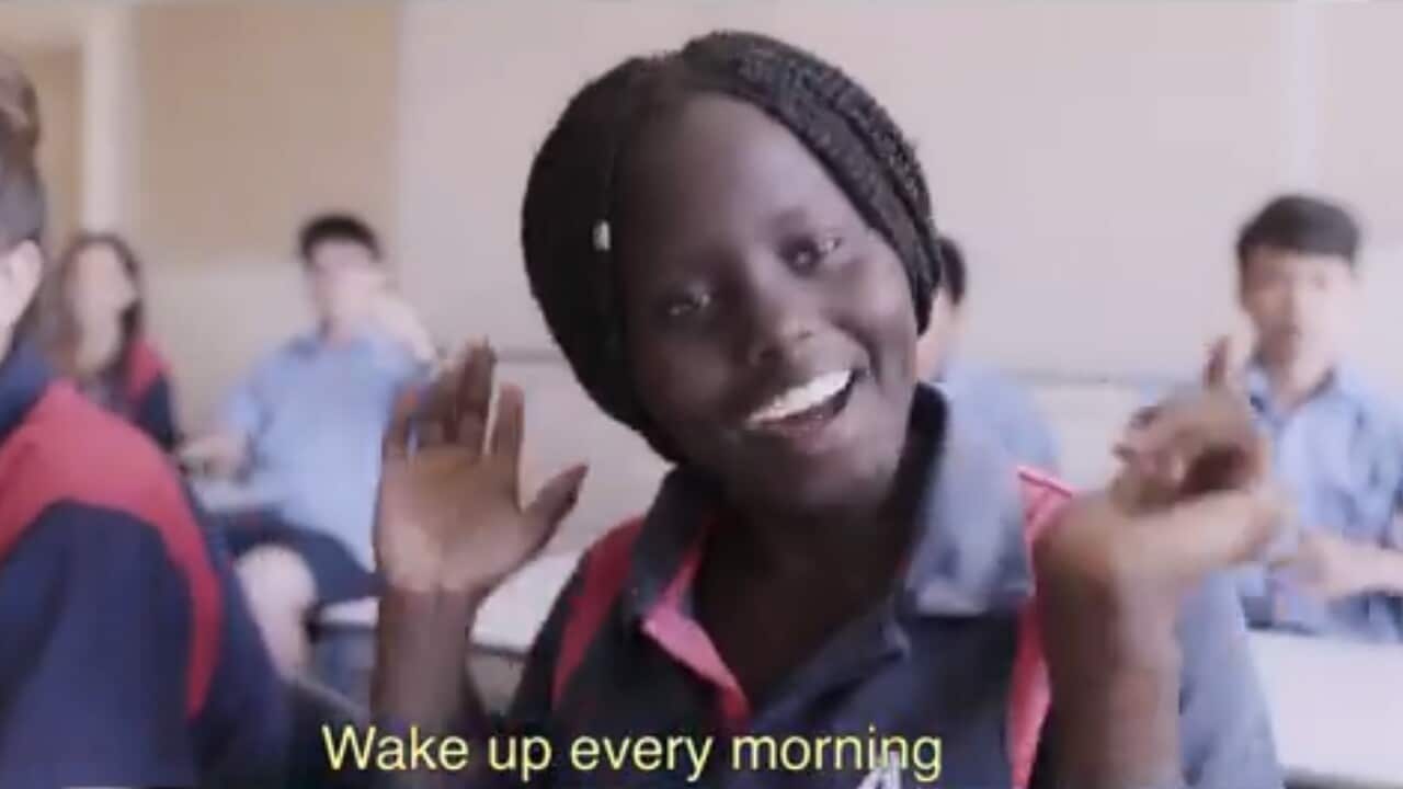 A student singing in the music video 