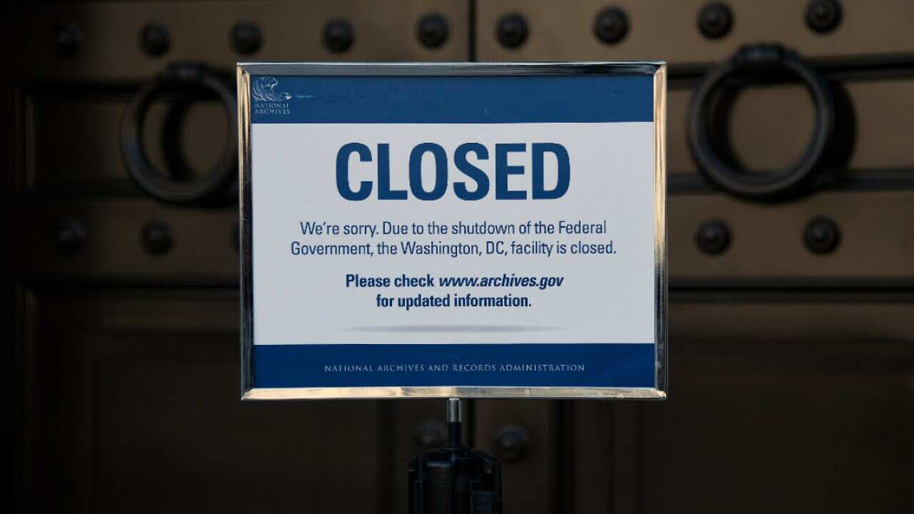 A sign announcing closure of the National Archives due to a partial government shutdown is displayed in Washington, D.C., U.S., on December 24, 2018 (AAP)