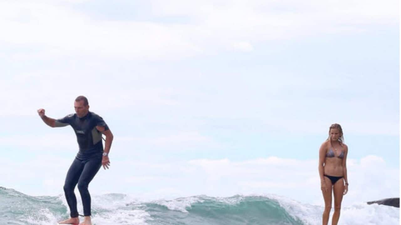 Former prime minister Tony Abbott and surfer Ivy Thomas at Tea Tree Bay, near Noosa, NSW.