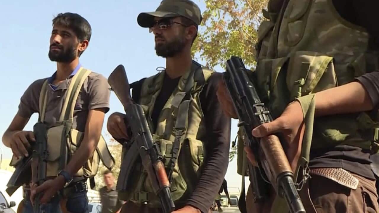 Turkish-backed Syrian opposition forces patrol in Dabiq, Syria