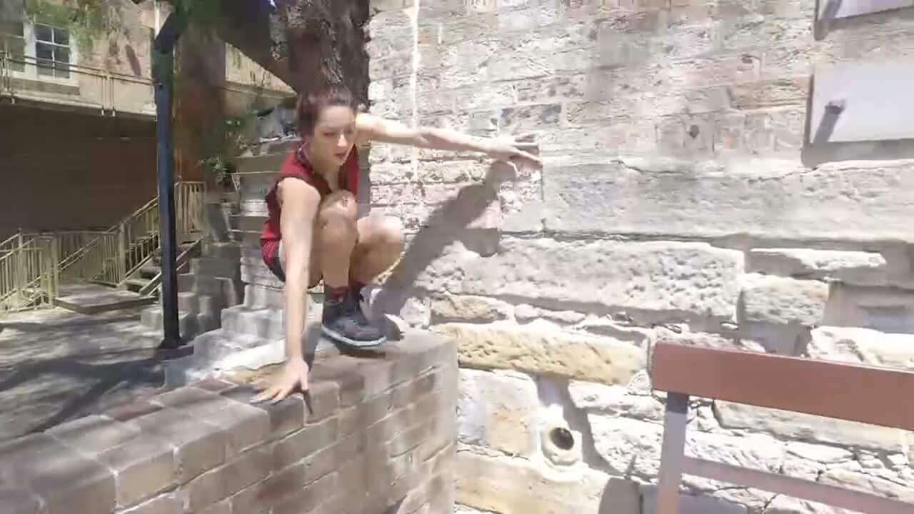 Leaping over concrete obstacles is a big part of parkour.