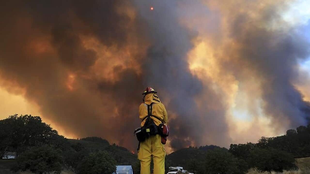 A tower of smoke pours from Cow Mountain at Burney, California