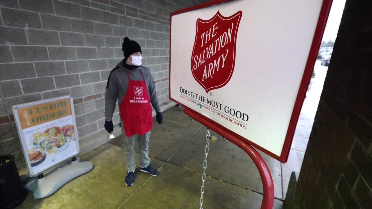 A Salvation army staff member at the charity’s donation kettle