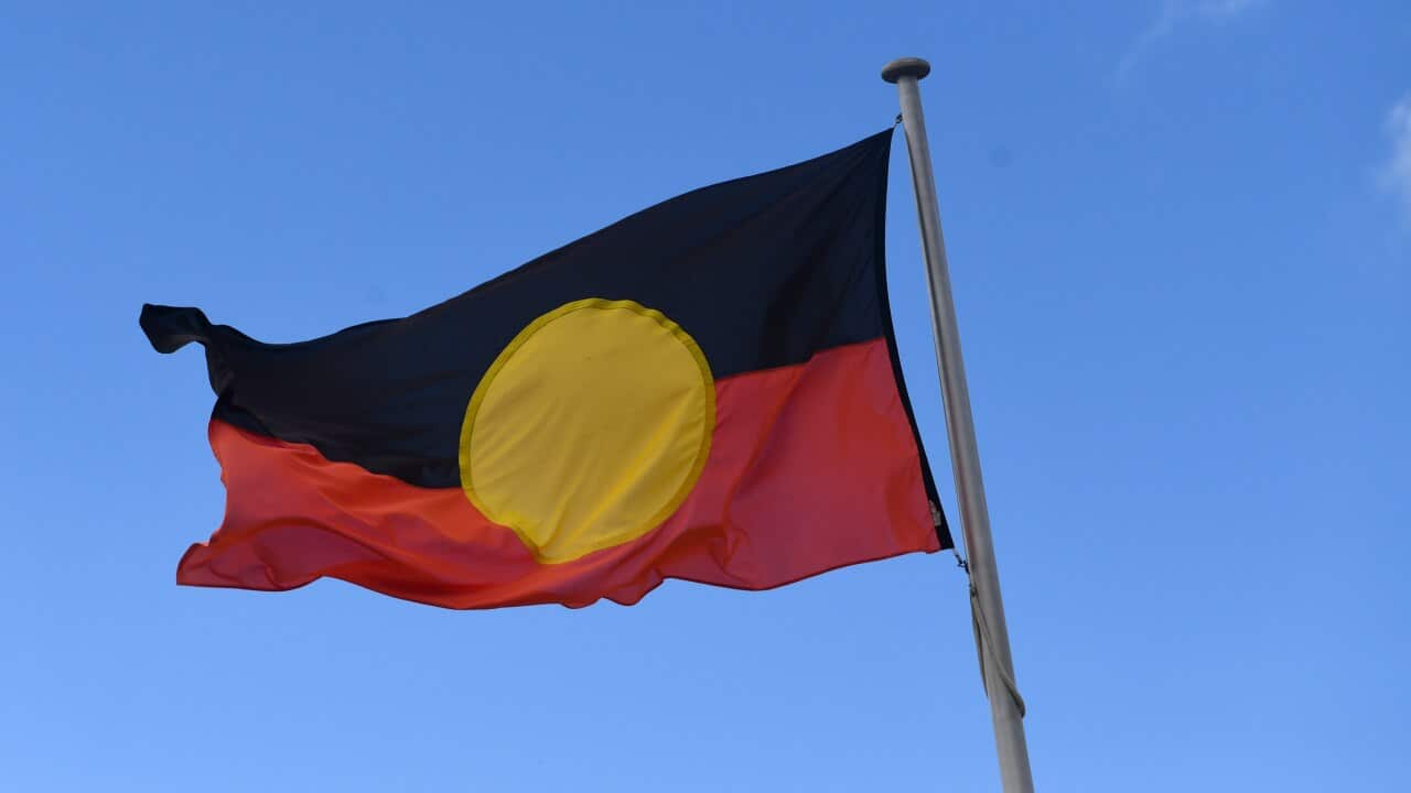 An Australian Aboriginal flag is seen in Canberra, Tuesday, February 4, 2022. (AAP Image/Lukas Coch) NO ARCHIVING
