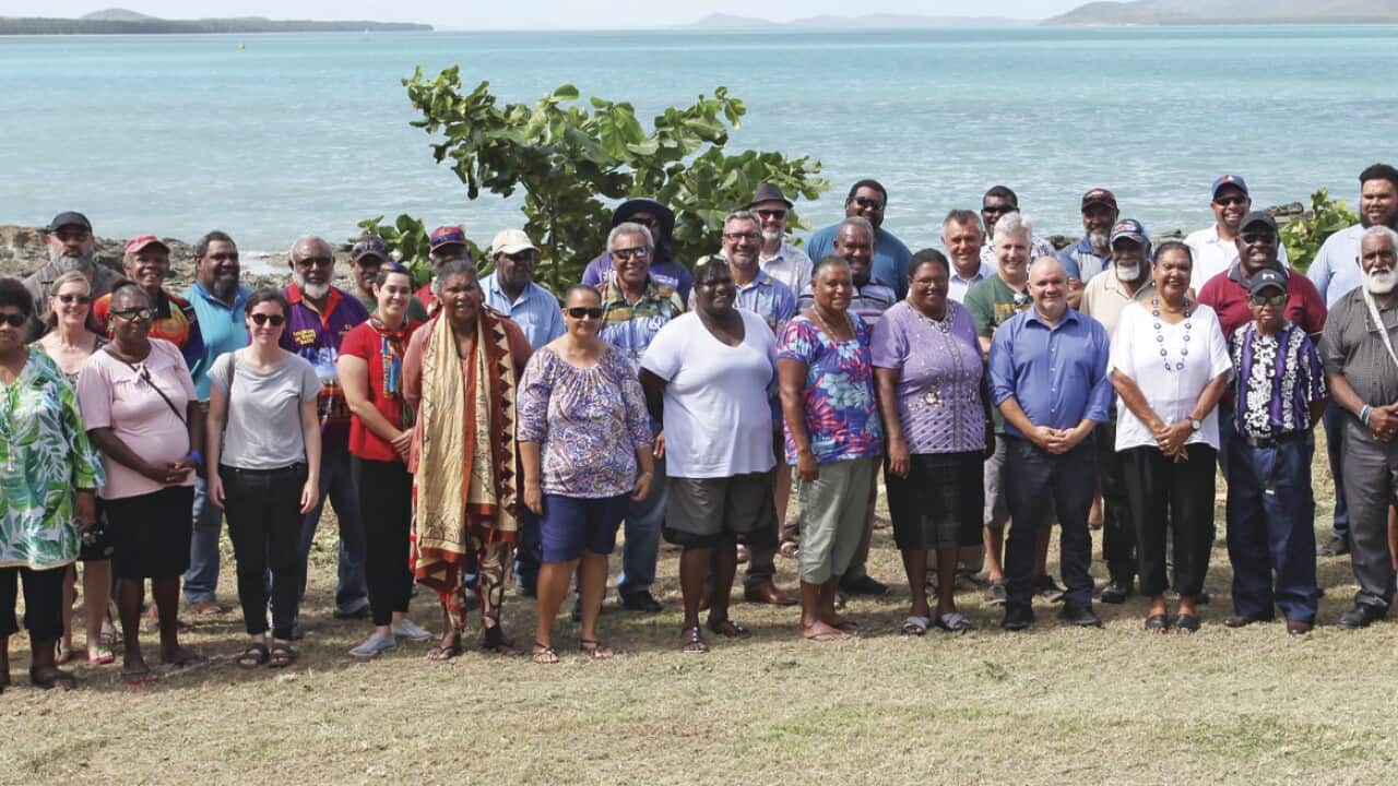 Delegates line up for a group photo