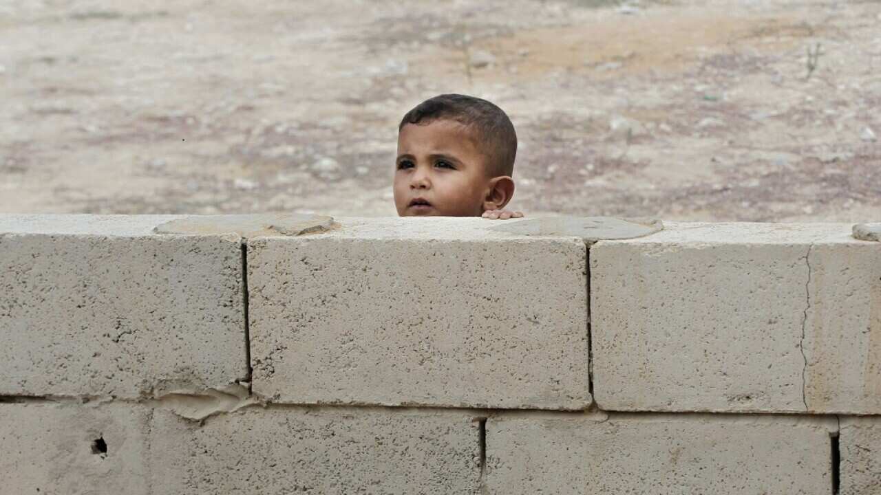 A Syrian boy peeks