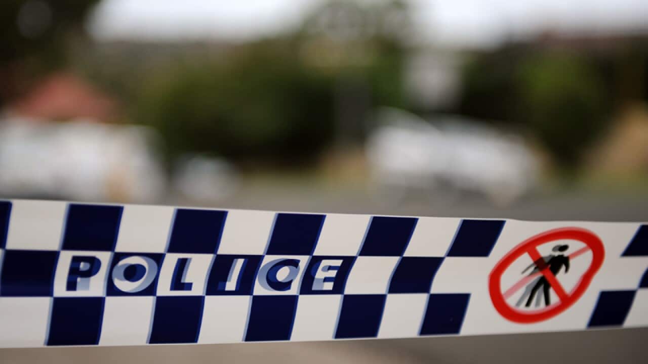 Police tape restricts access to a street in Sydney