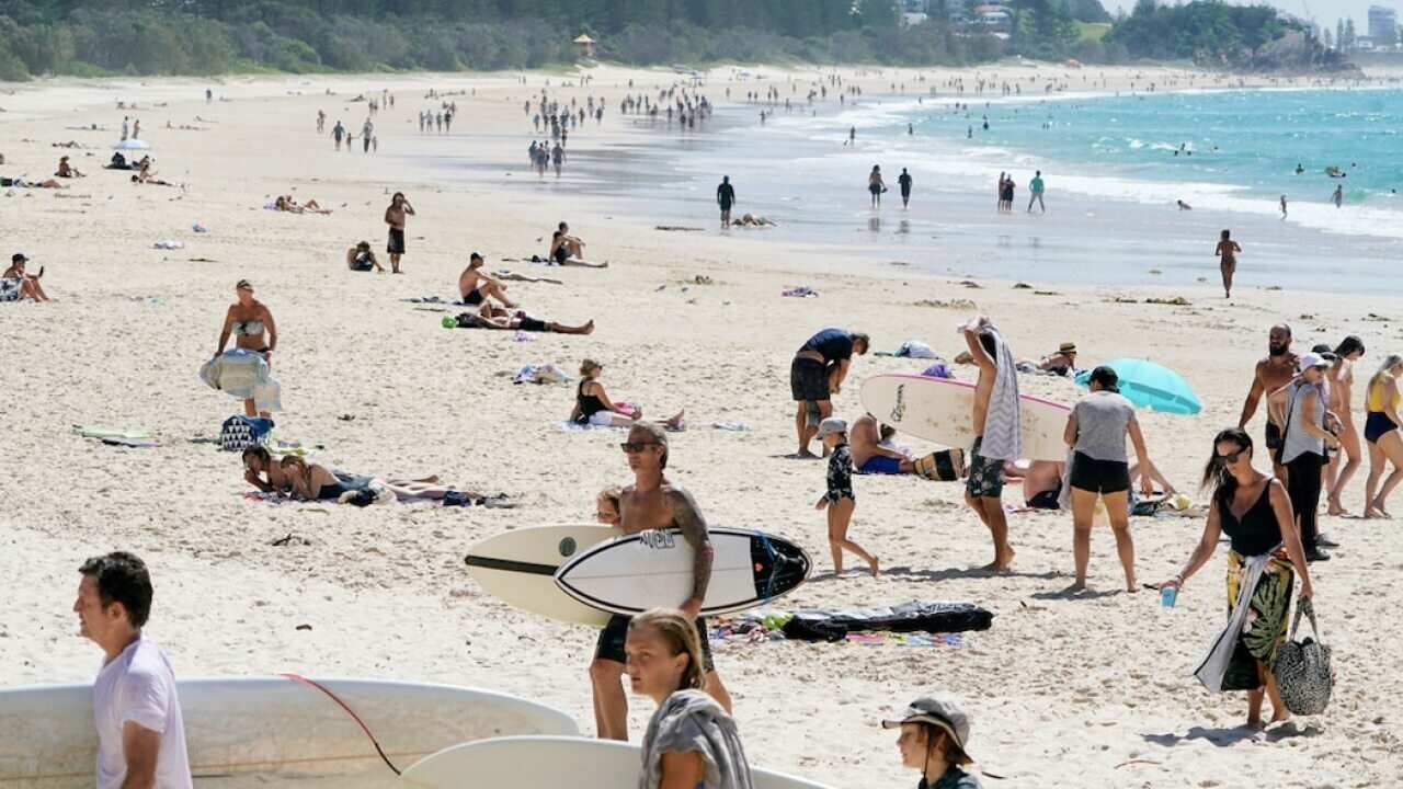 Crowds are seen at Burleigh Beach on the Gold Coast, Sunday, April 5, 2020
