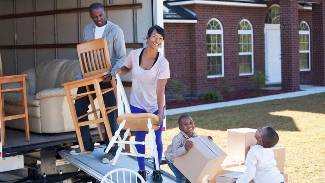 African American family moving house