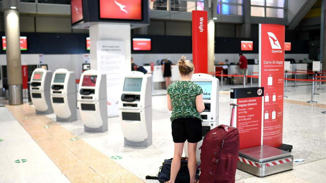 A passenger checks in at Brisbane airport