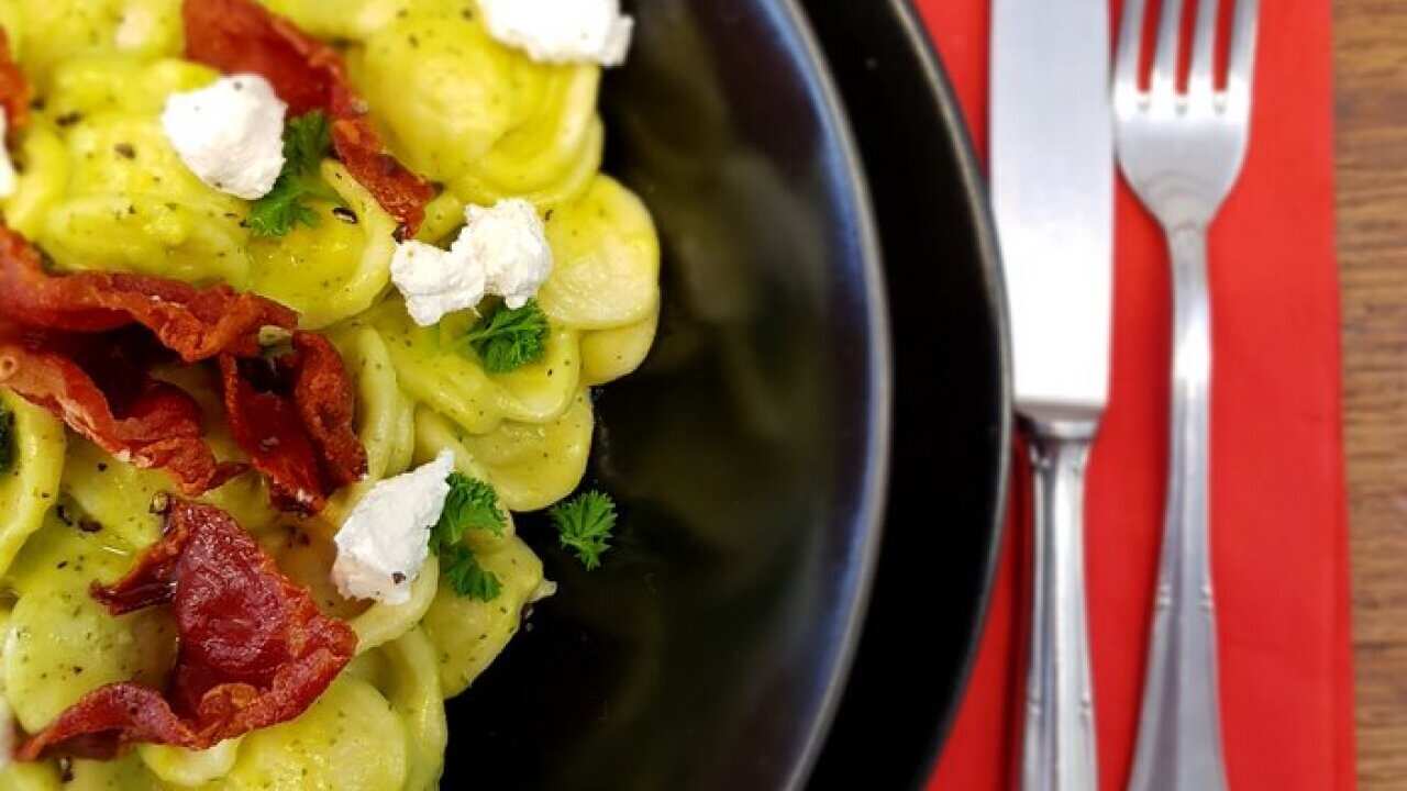 Orecchiette, with crispy prosciutto and fresh cheese.