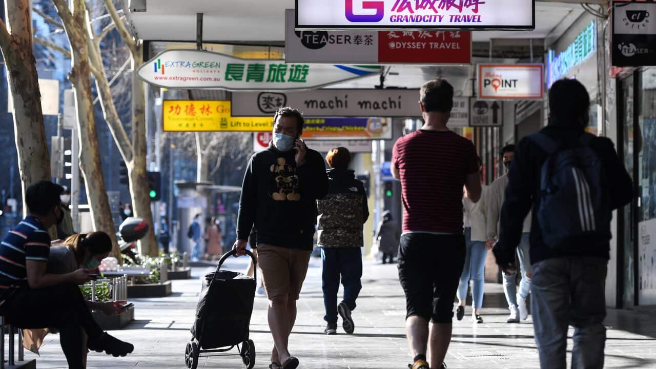 People are seen on Swanston Street in Melbourne, Sunday, September 6, 2020.