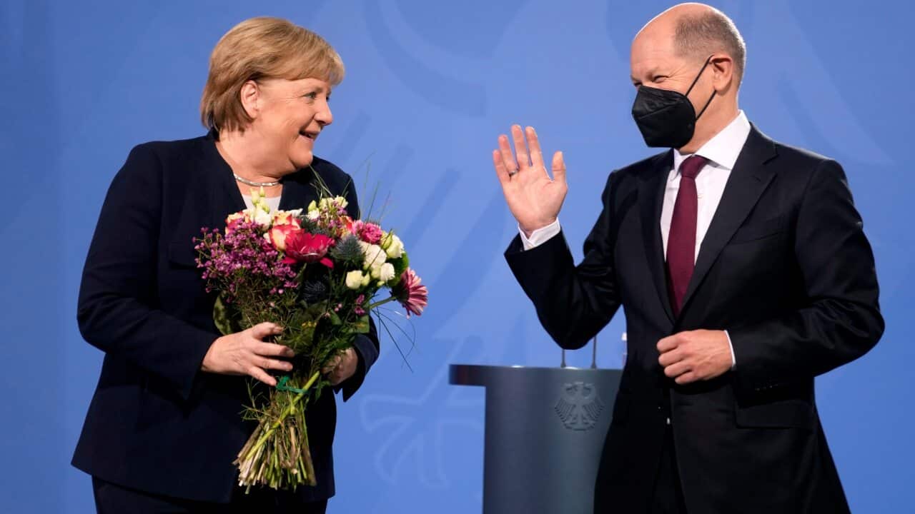 New elected German Chancellor Olaf Scholz and former Chancellor Angela Merkel during a handover ceremony in the chancellery in Berlin, Wednesday, Dec. 8, 2021. (Photo/Markus Schreiber)