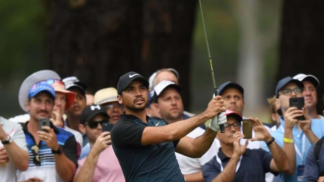 Jason Day of Australia plays his second shot at the sixteenth hole.
