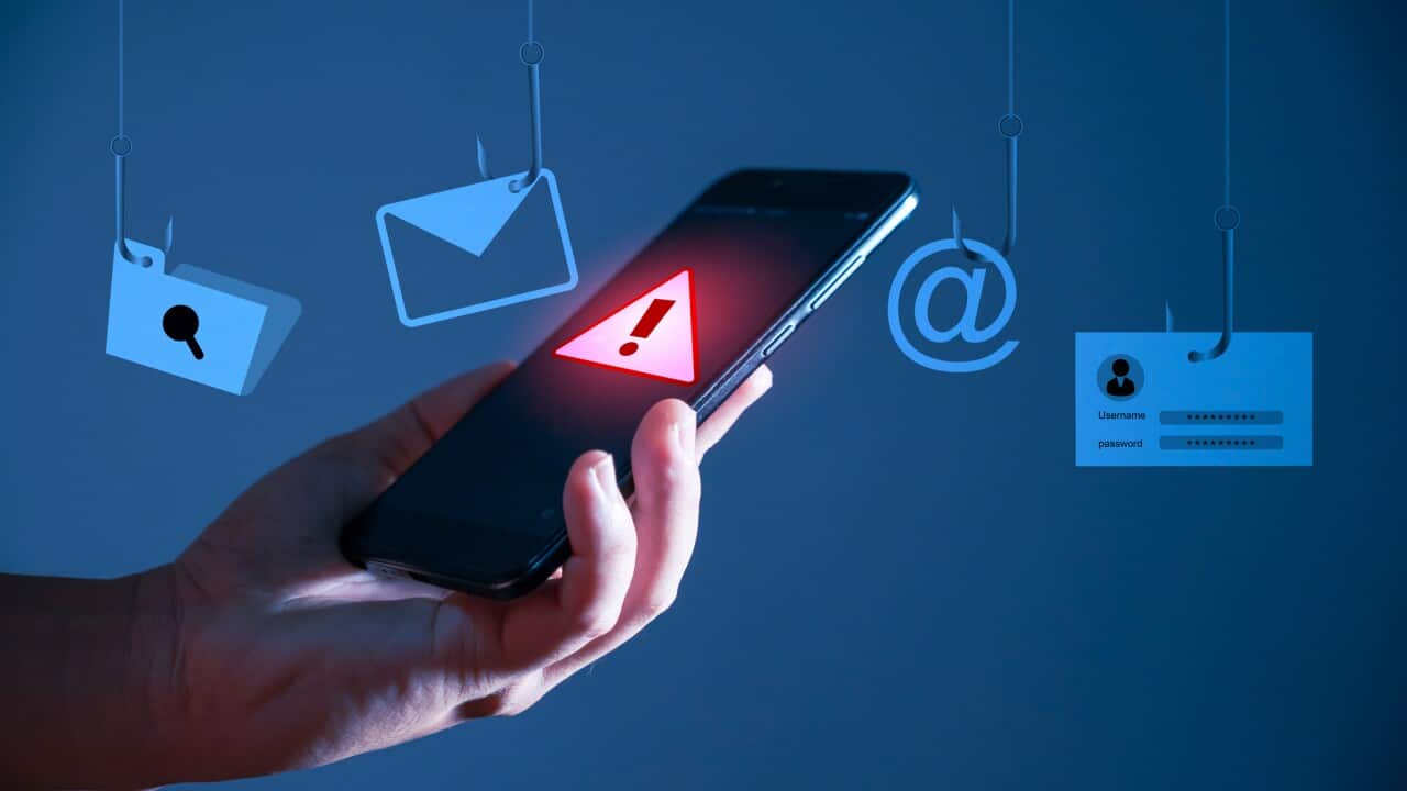 Username and password' on a fishing hook. Conceptual image about the risk of internet identity theft, also known as Phishing.