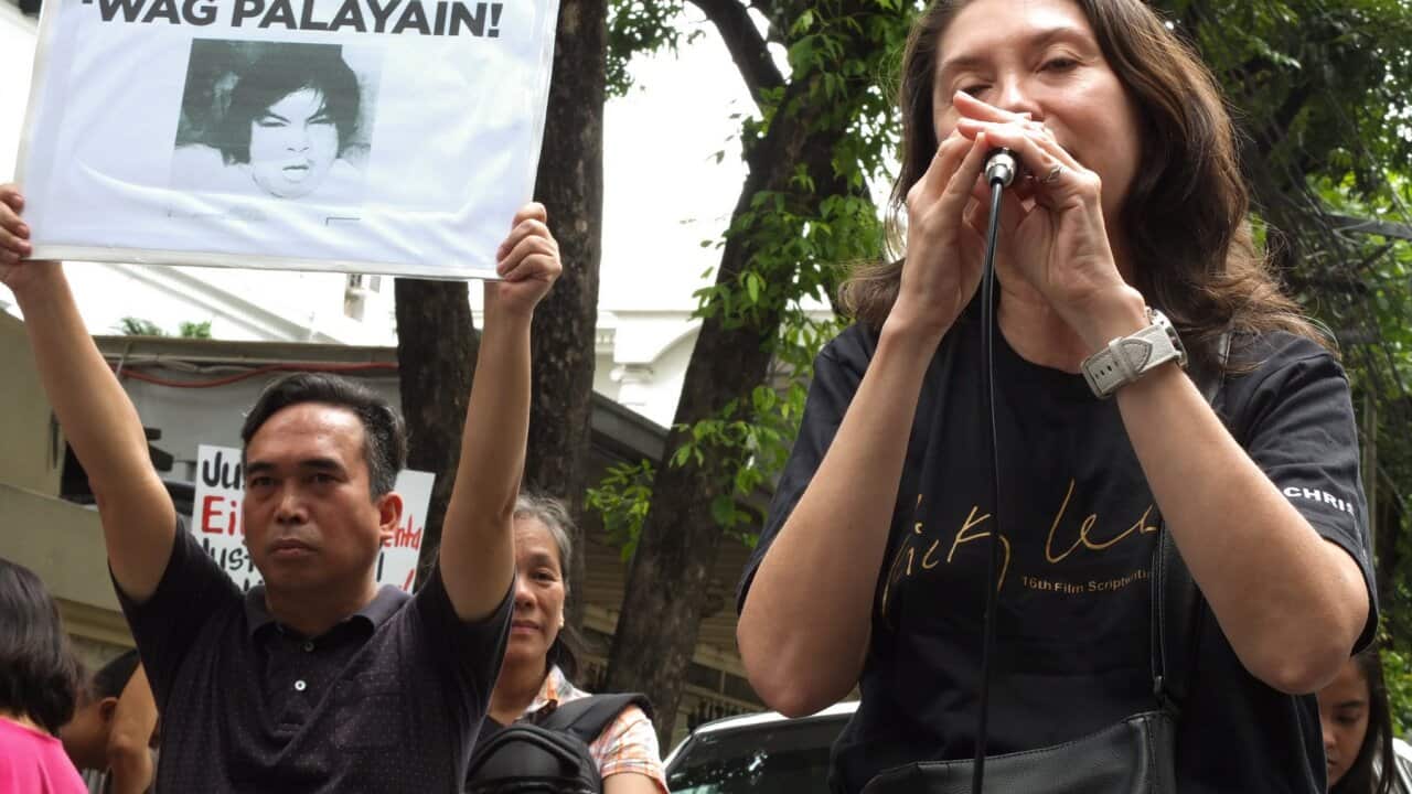 Christine Carlos, from the movie Industry speaks during the demonstration.