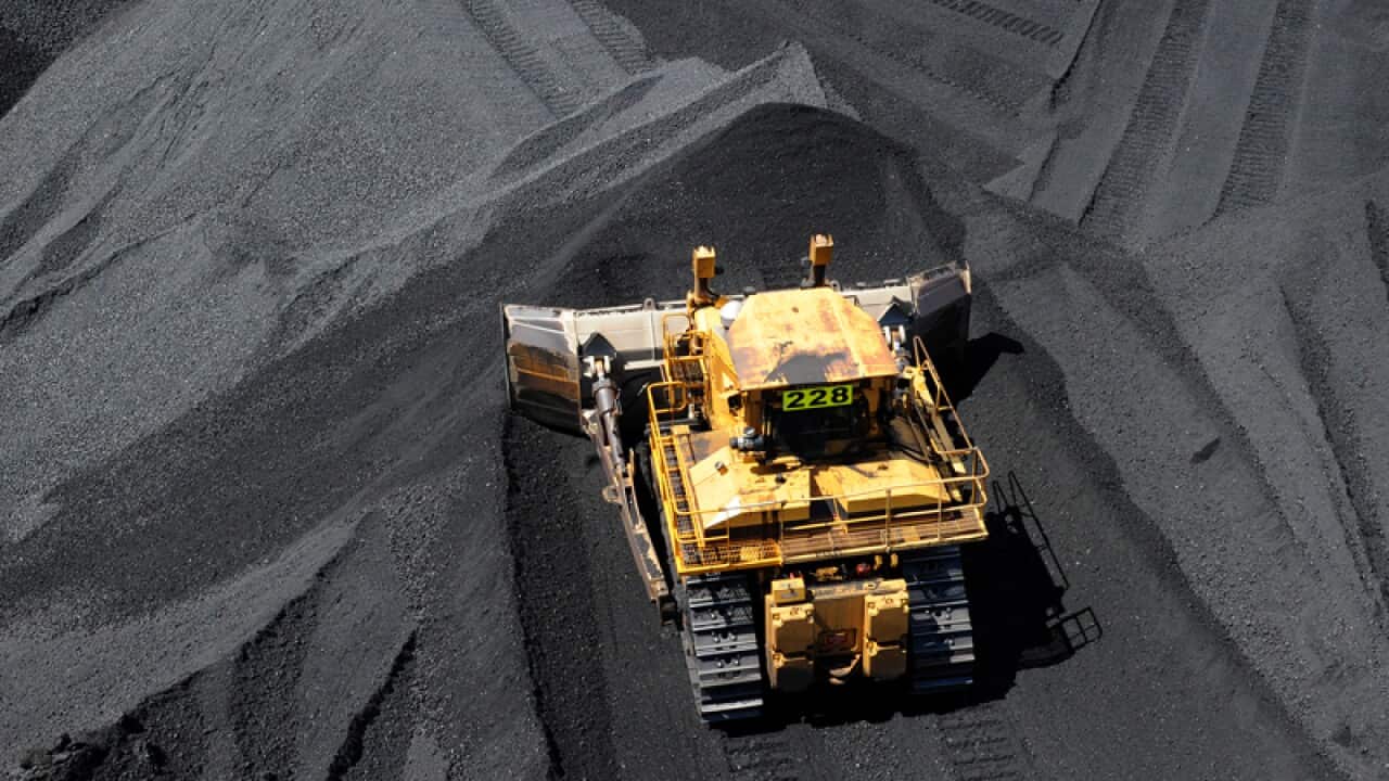 Coal is stockpiled before being loaded onto ships