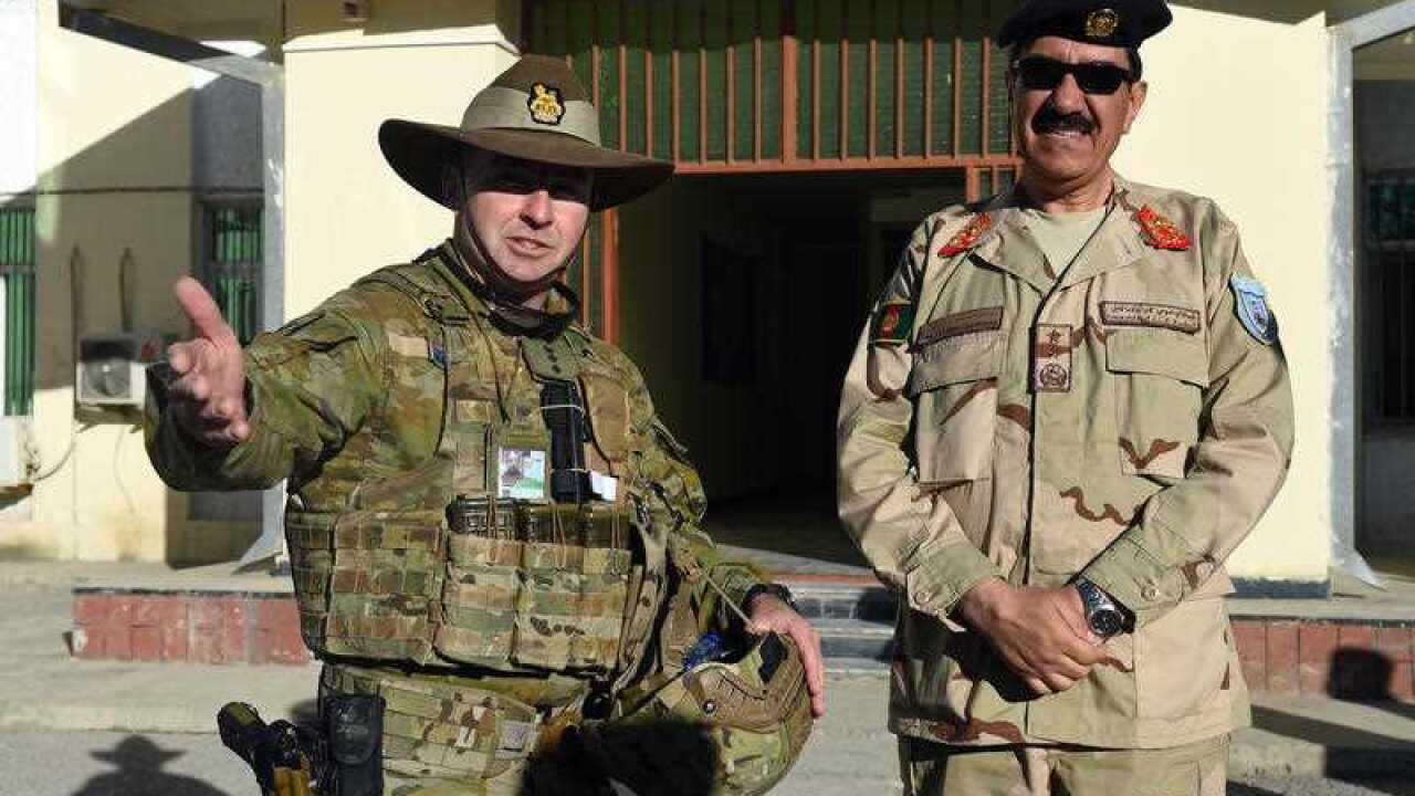 Australian Defence Force Colonel Andrew McBaron (left) talks with Major General Salim Ibrahimi, Commander of the Kabul Garrison Command.