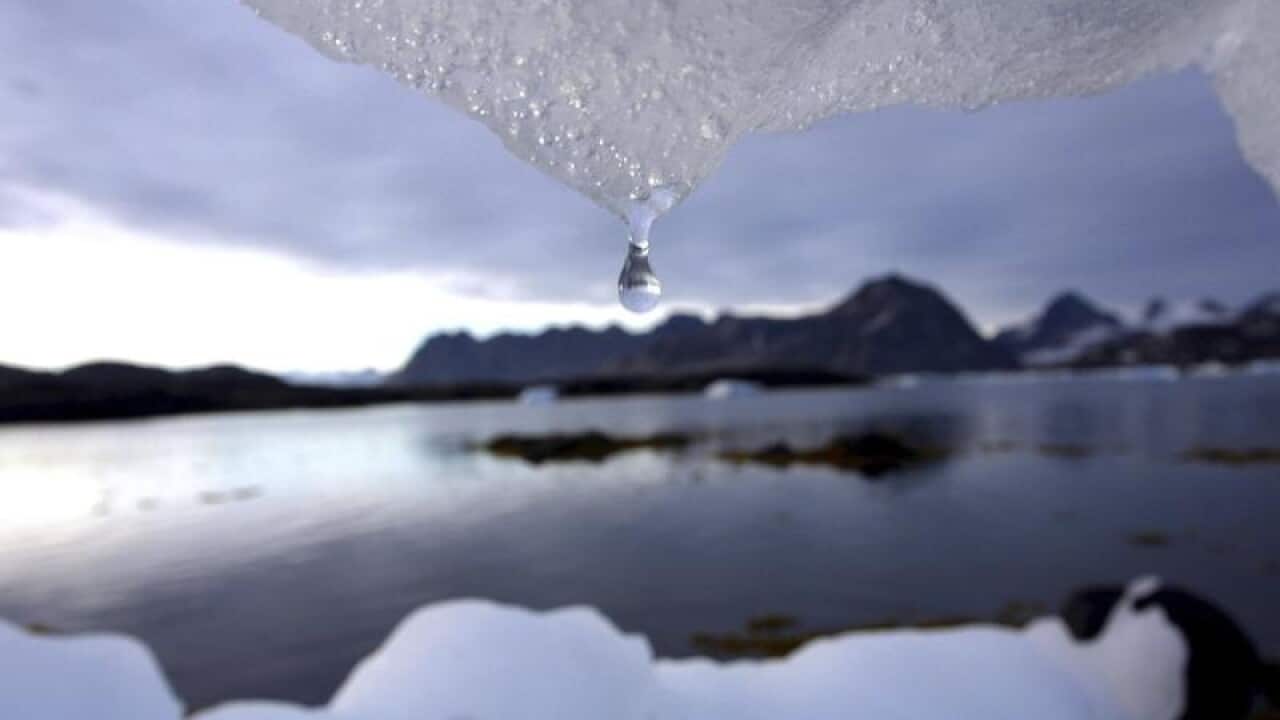 Iceberg melts in Kulusuk, Greenland