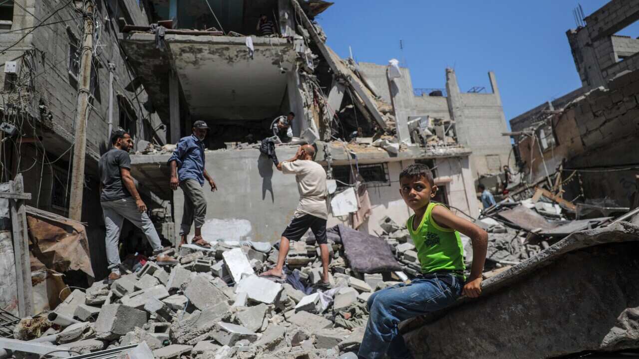 Palestinians search for survivors following Israeli airstrike on at al-Nuseirat refugee camp