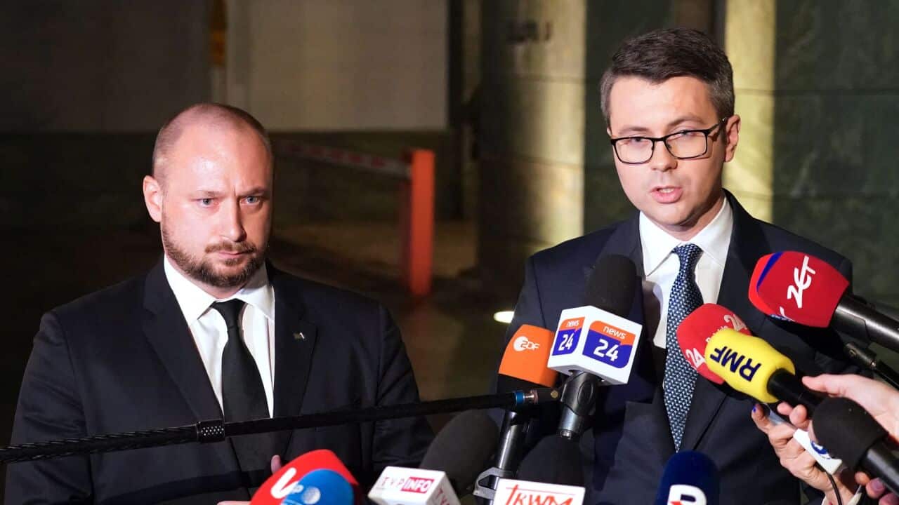 Two men speak at a press conference