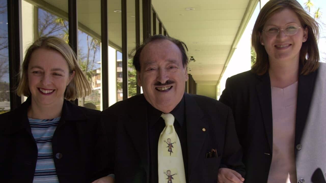 Shadow Immigration Minister Nicola Roxon (L), former Immigration Minister in the Whitlam government Al Grassby (C) and Shadow sport minister Kate Lundy at the National Press Club in Canberra
