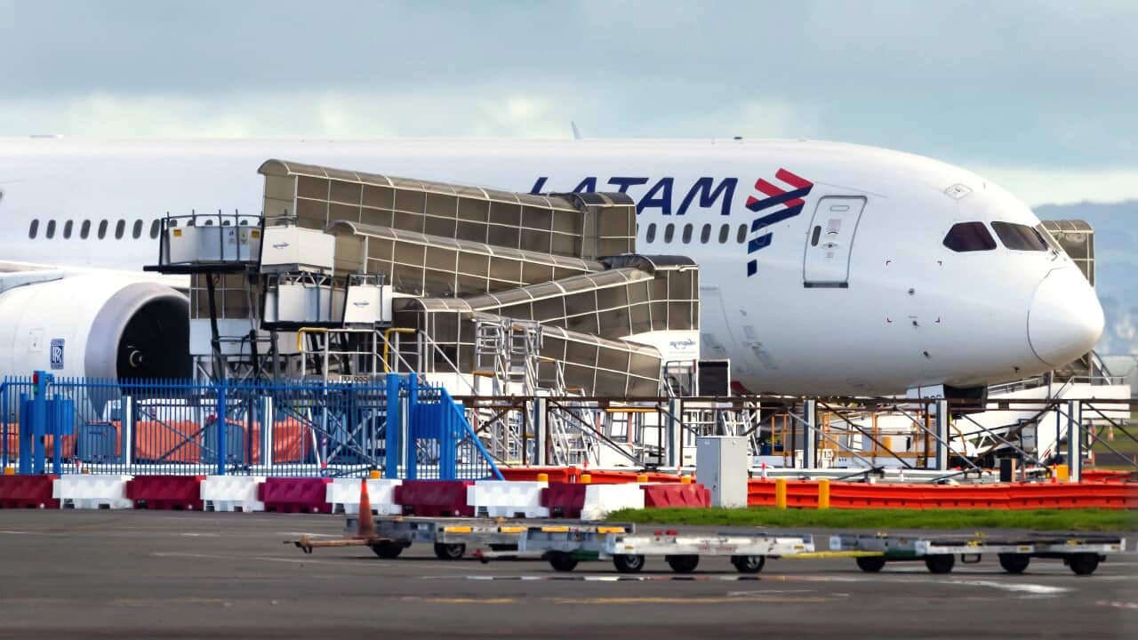 A plane sitting on the tarmac