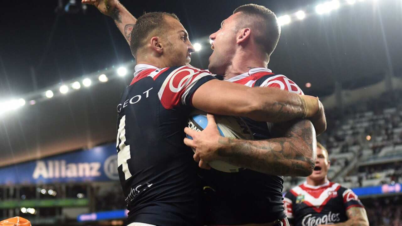Roosters' Shaun Kenny-Dowall celebrates a try