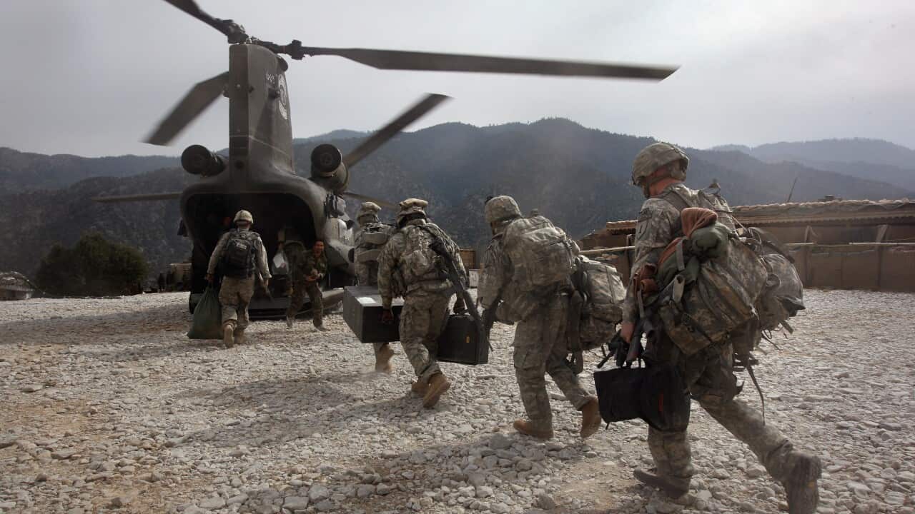 US soldiers board an Army Chinook helicopter in Korengal Valley, Afghanistan. Mr Trump had tried to bring the Taliban to the table, until talks fell through.