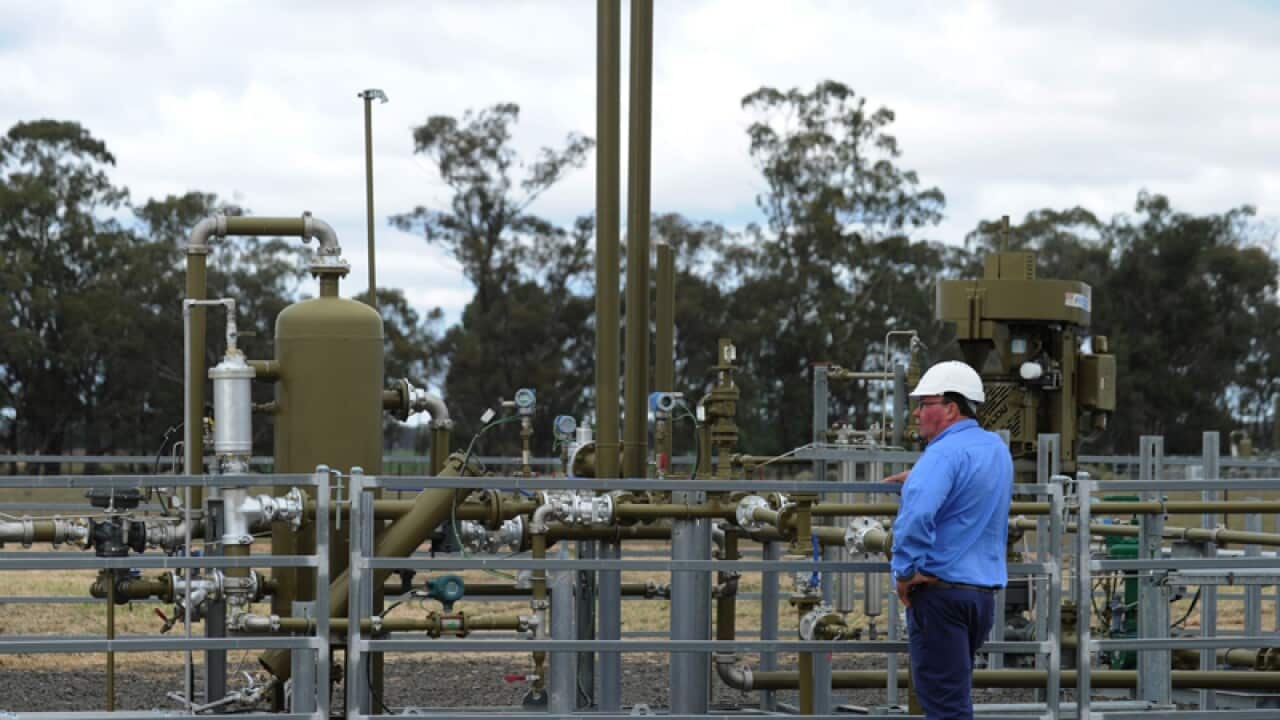 Santos staff at a Tinsfield coal seam gas pilot well