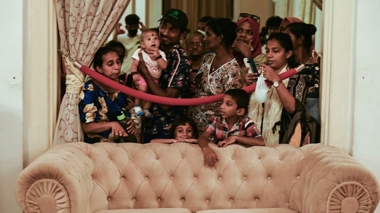 People visit Sri Lankan President Rajapaksa's official residence following his departure