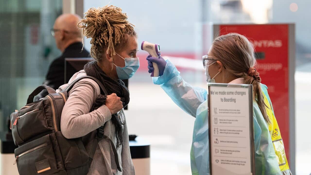 Passengers arriving from Melbourne have their temperatures checked by NSW Health