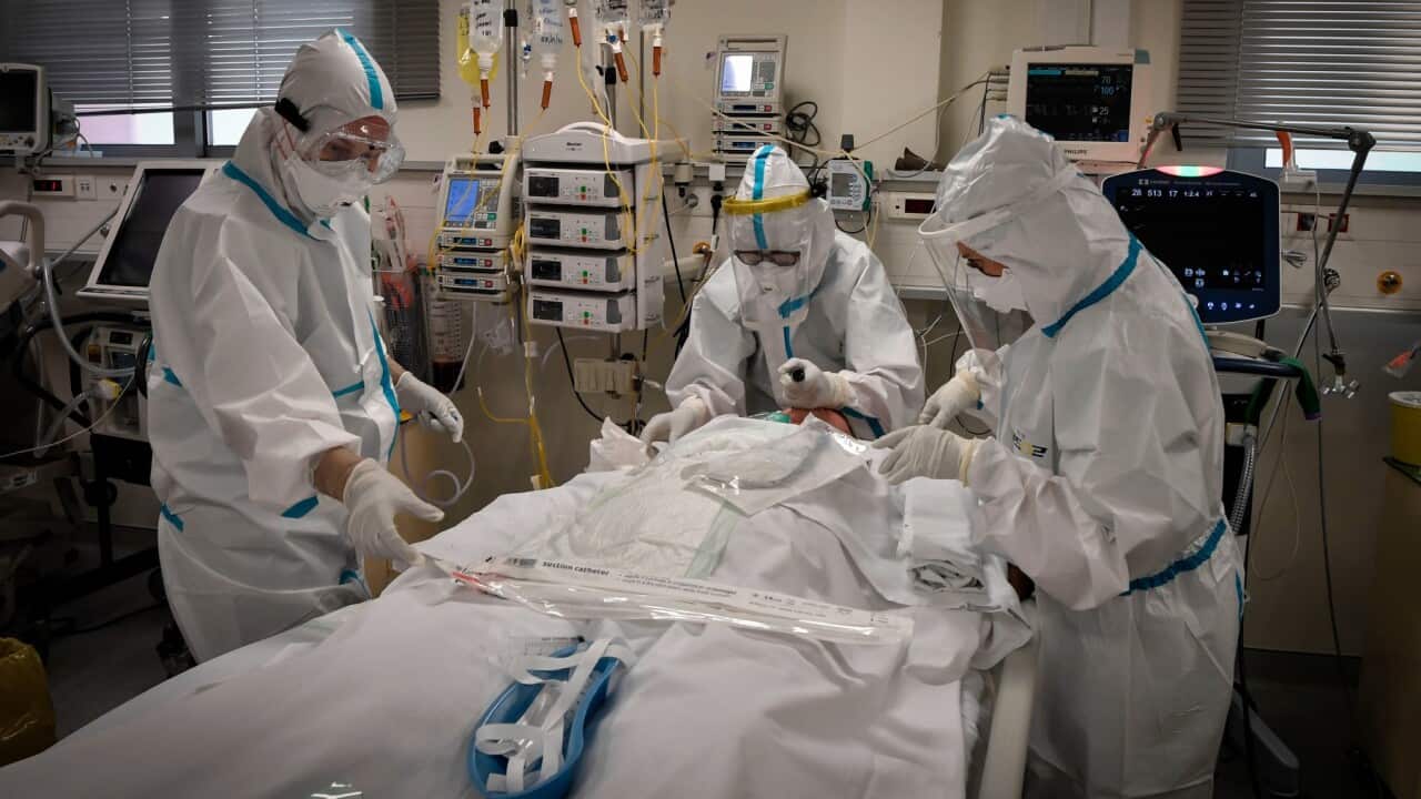 Nurses attend to COVID-19 patient in Greece