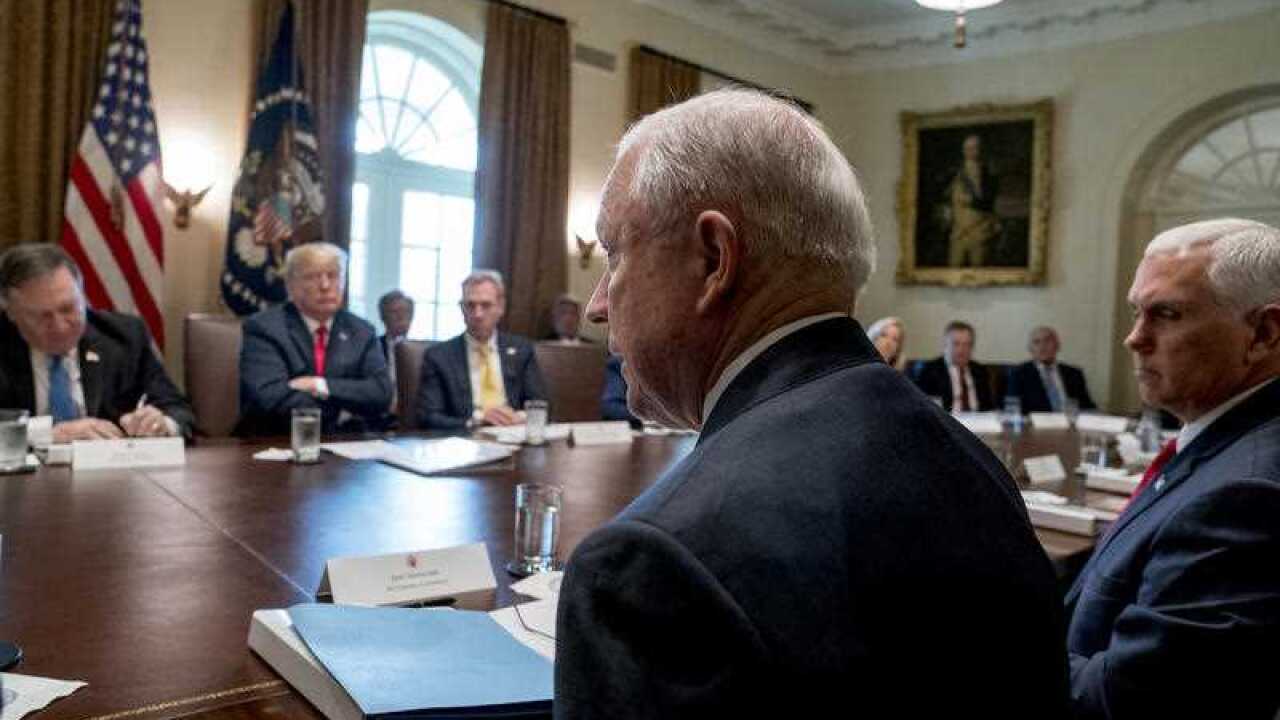 Attorney General Jeff Sessions, Secretary of State Mike Pompeo, left, President Donald Trump, second from left, Vice President Mike Pence at the White House