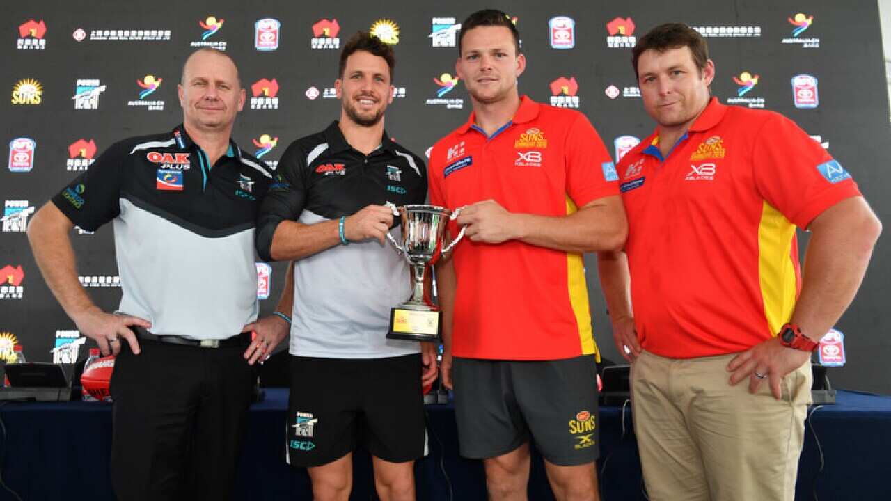 (L-R) Port Adelaide Power coach Ken Hinkley and player Travis Boak, Gold Coast Suns player Steven May and coach Stuart Dew in Shanghai